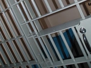 Woman files wrongful termination suit against department of corrections